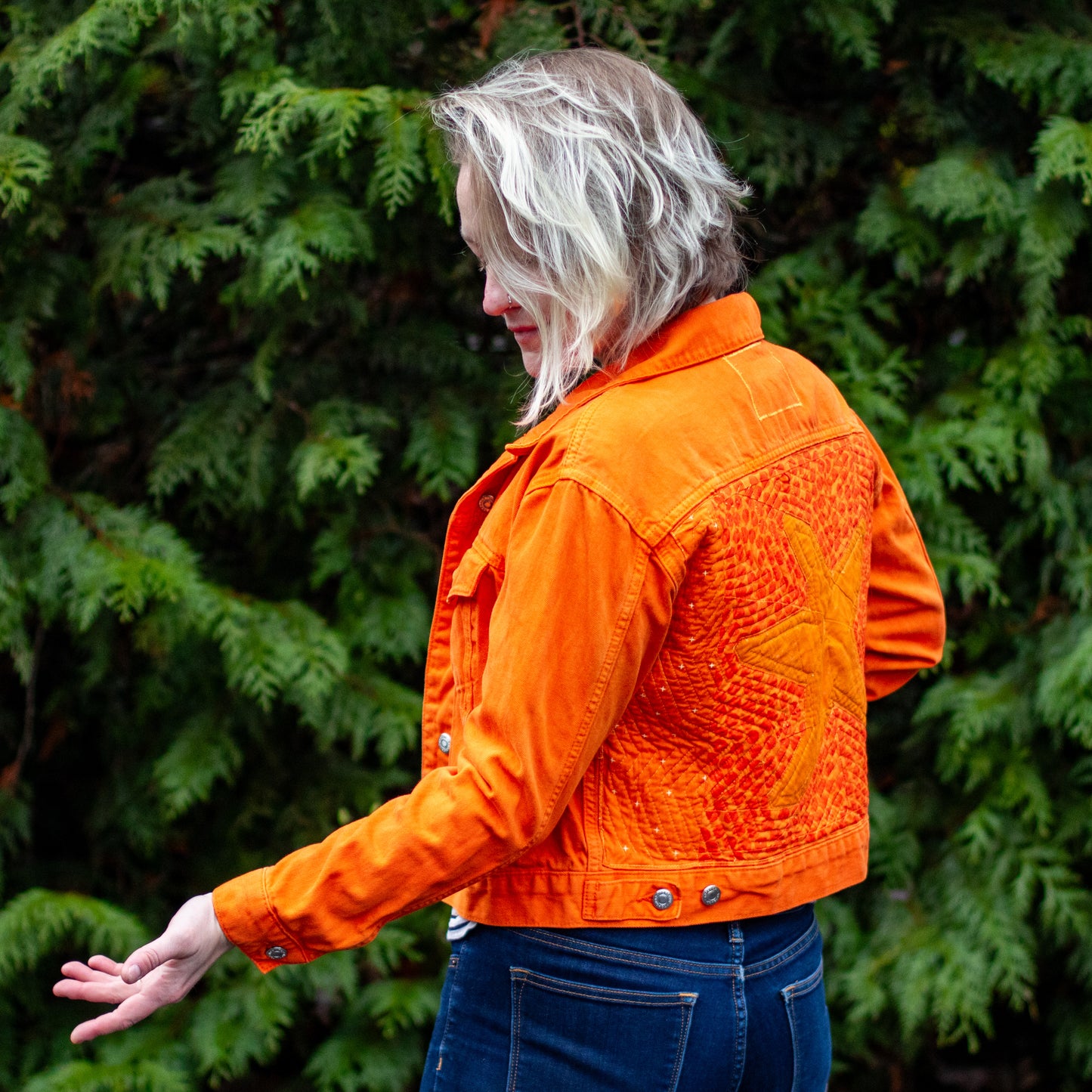 “she’s a walking pisaster” handmade quilted denim jacket | bright orange quilted sea star denim jacket