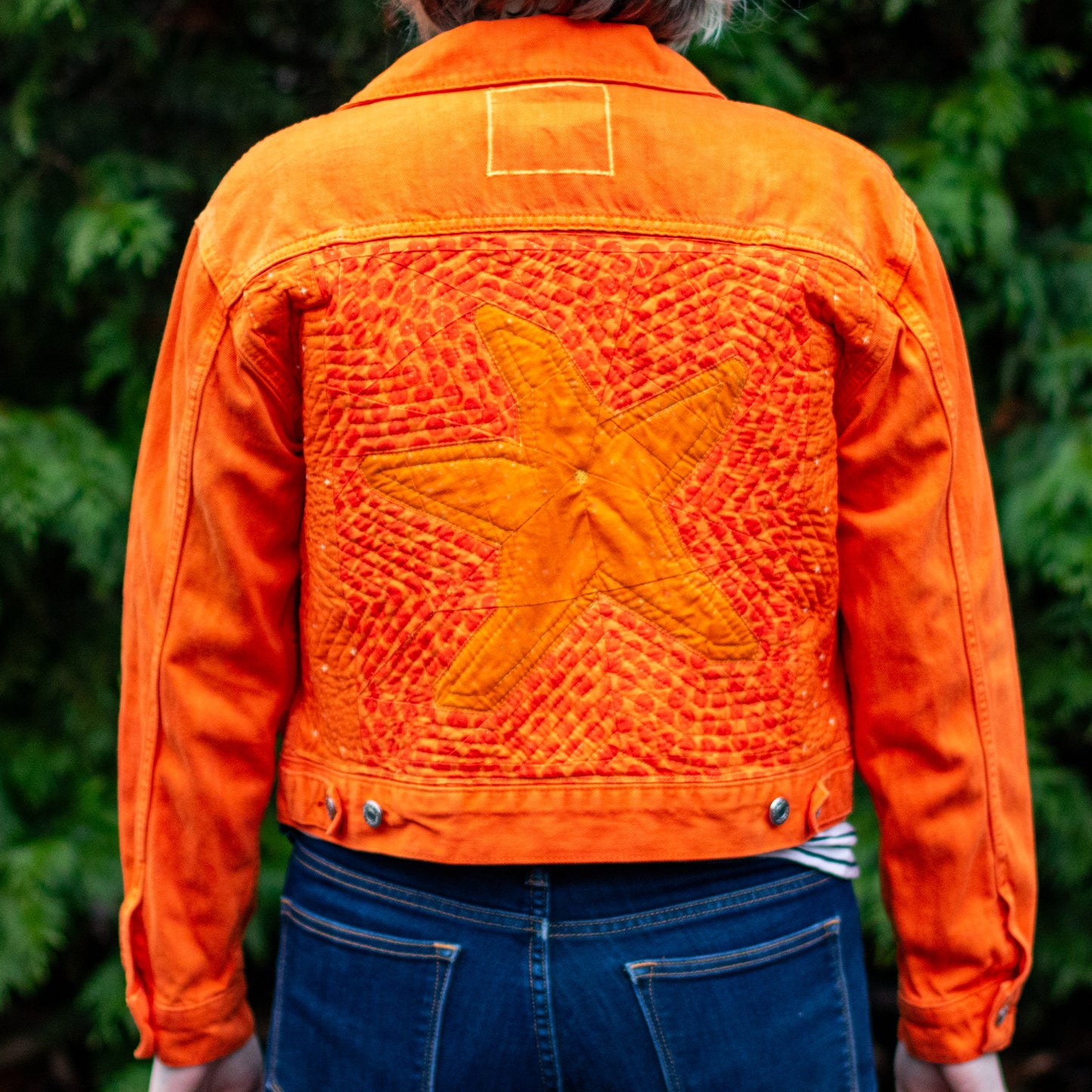 “she’s a walking pisaster” handmade quilted denim jacket | bright orange quilted sea star denim jacket