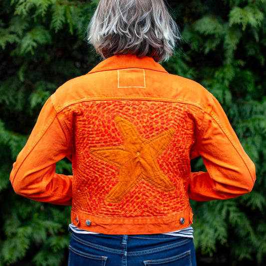 “she’s a walking pisaster” handmade quilted denim jacket | bright orange quilted sea star denim jacket